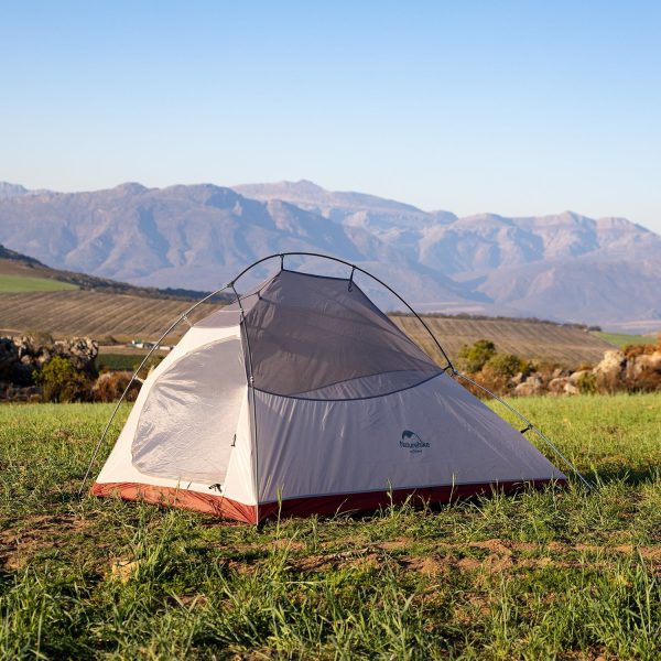 Naturehike Cloud Up 2-Person Ultralight Backpacking Tent set up in mountain terrain, ideal for lightweight backpacking, hiking, and outdoor adventures